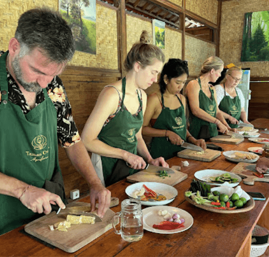 people cooking together in bali cooking class