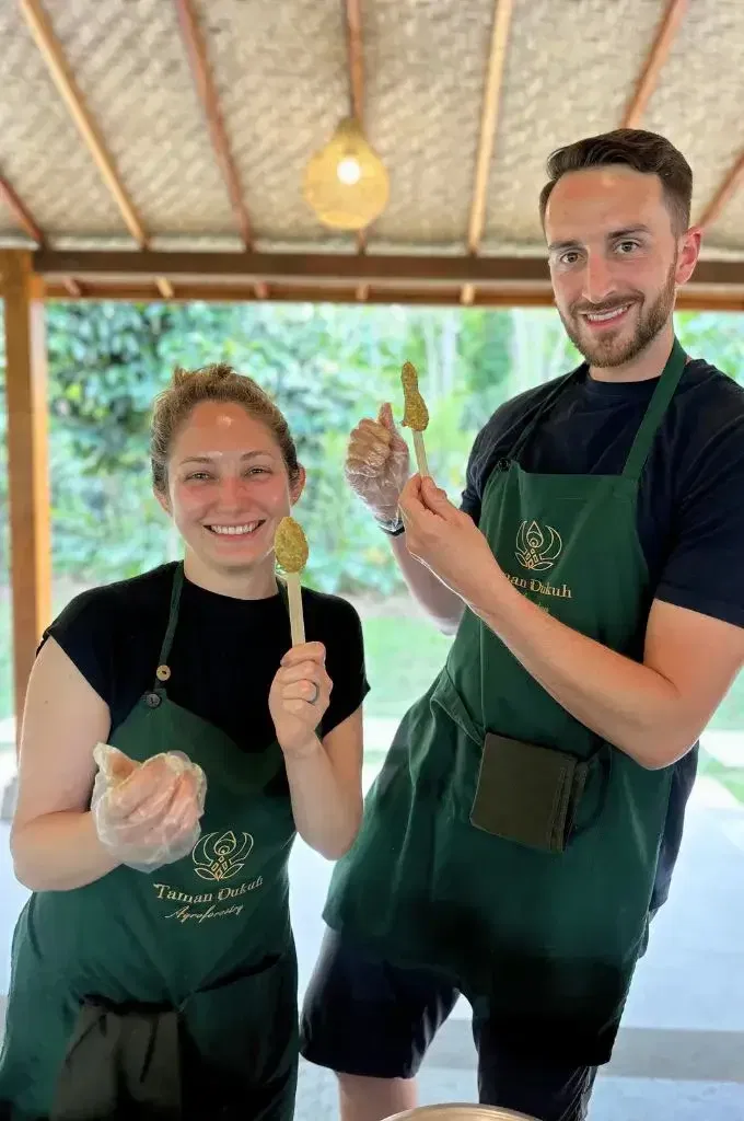 man and women are making satay lilit at taman dukuh bali