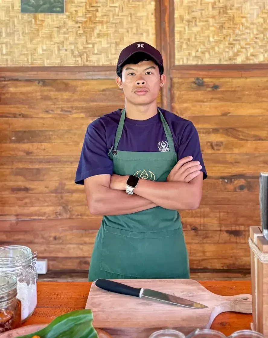 Buda Wardana, instructor teaching home-style Balinese cooking at Taman Dukuh, Ubud