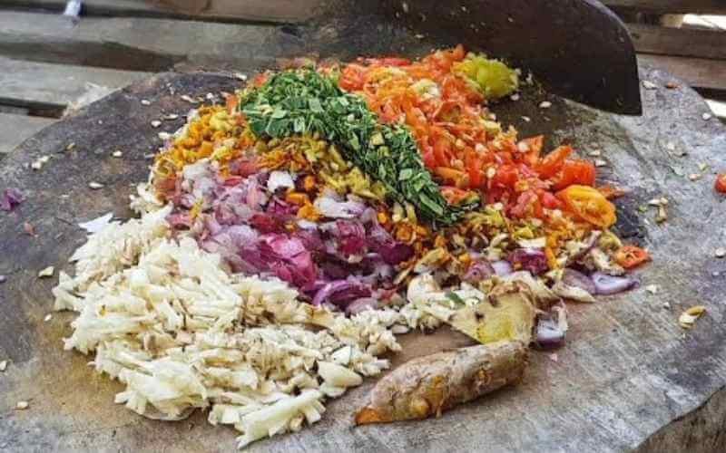 the art of very finely chopping or slicing ingredients, especially the diverse components of the all-important bumbu (Balinese spice pastes) using wooden chopping board and Balinese Cleaver