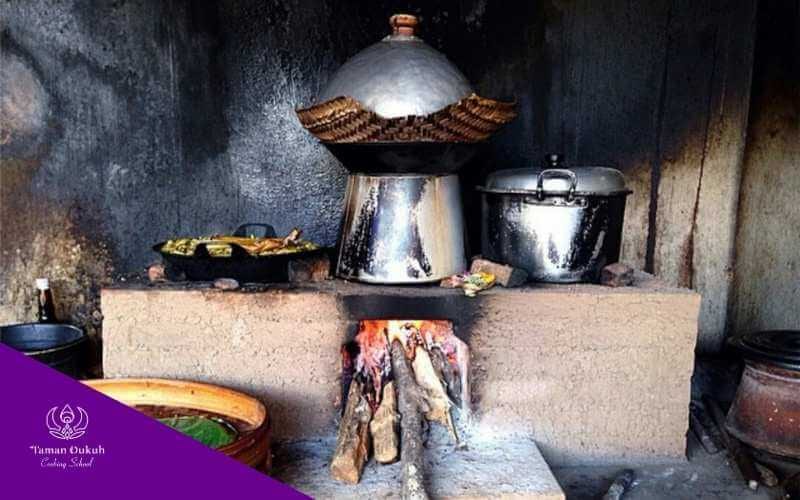 The traditional Balinese stove, Cangkem Paon, strategically placed according to Asta Kosala Kosali, embodying Dewa Brahma's fire element.