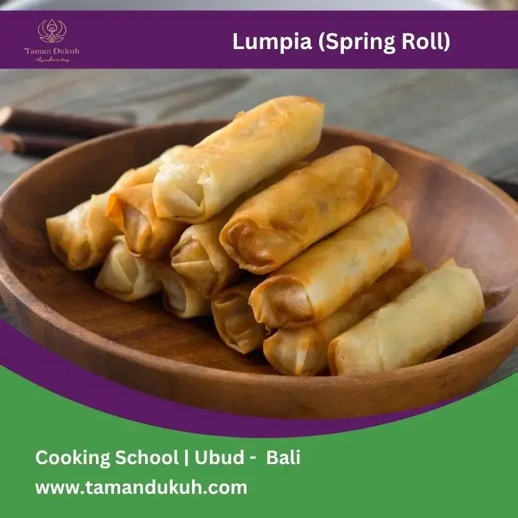 Spring roll or lumpia on wooden plate