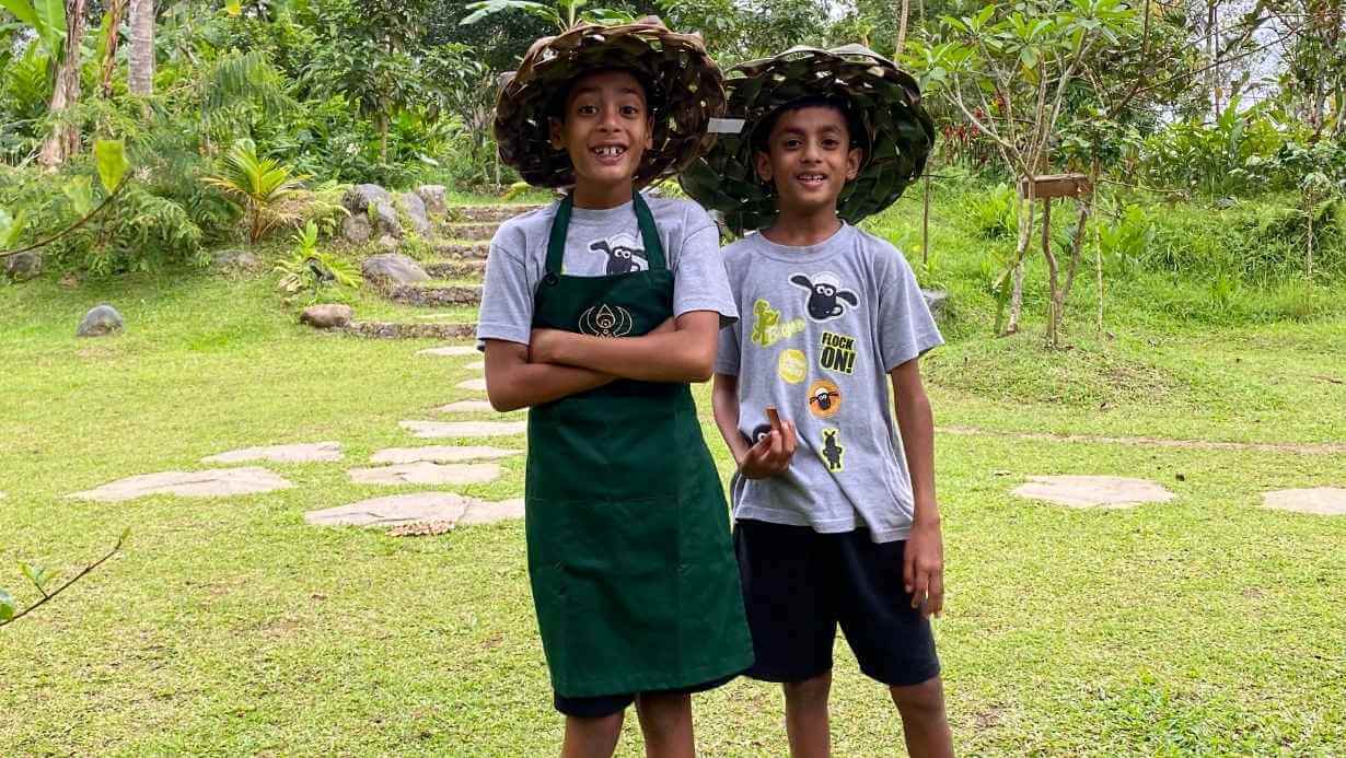 Youth, Kids & Family Cooking 8 2 kids wearing traditional hat joining farm to table cooking class in Bali