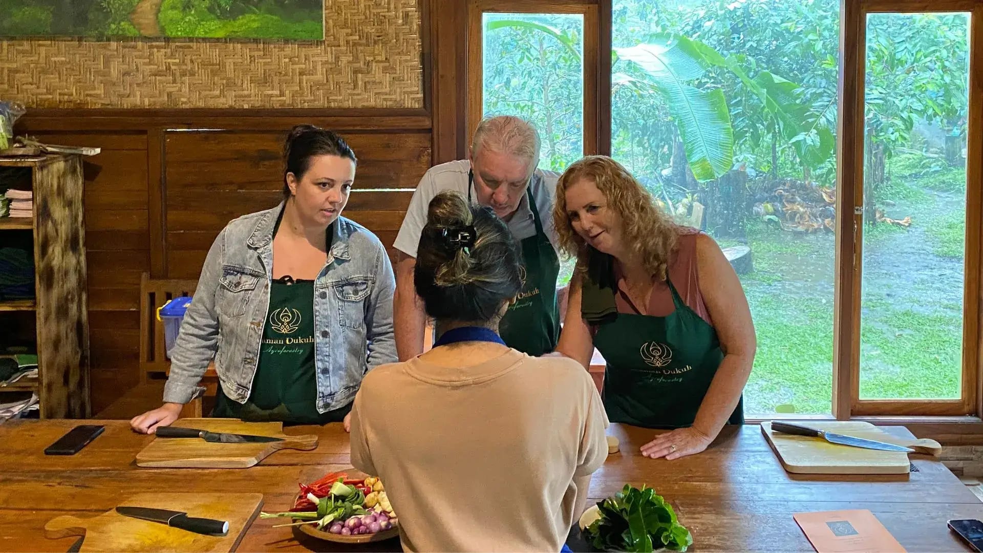 a couple doing cooking class in Ubud Guests enjoying a hands-on Private Cooking Class in Bali, guided by an expert chef.